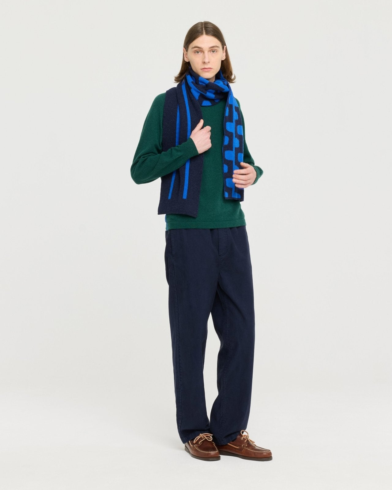 Lightweight merino wool blend knit made in Portugal with subtle contrast side detailing, soft and breathable for year-round layering.