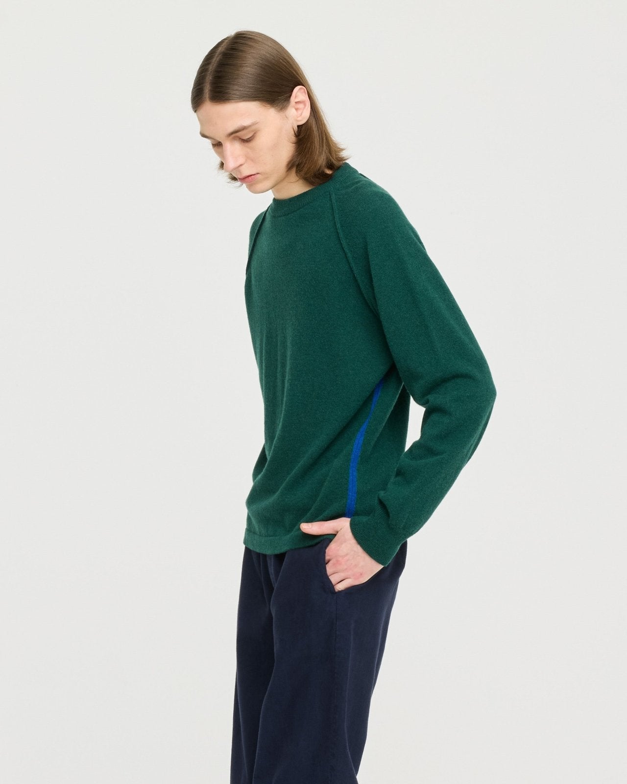 Lightweight merino wool blend knit made in Portugal with subtle contrast side detailing, soft and breathable for year-round layering.