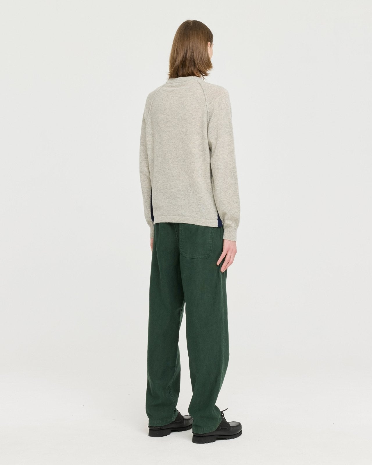 Lightweight merino wool blend knit made in Portugal with subtle contrast side detailing, soft and breathable for year-round layering.