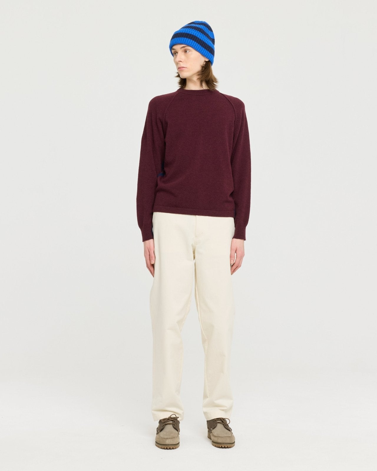 Lightweight merino wool blend knit made in Portugal with subtle contrast side detailing, soft and breathable for year-round layering. 