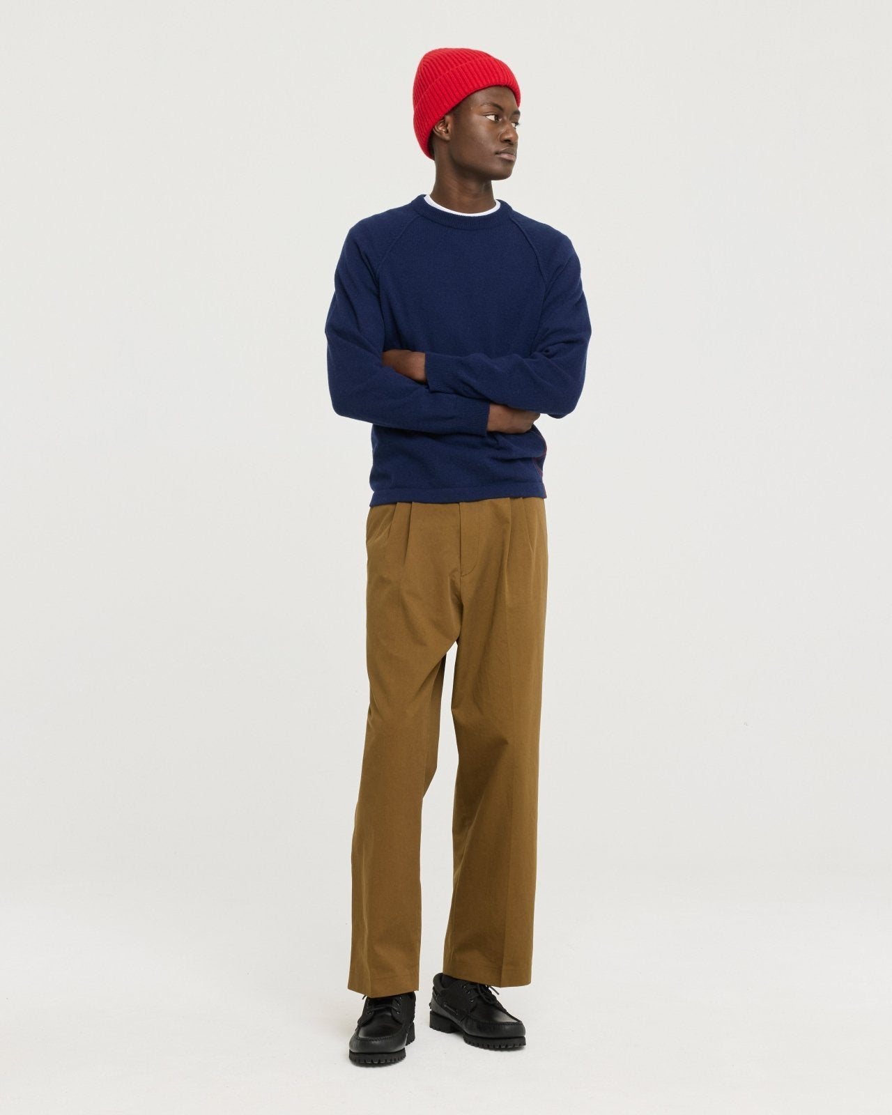 Lightweight merino wool blend knit made in Portugal with subtle contrast side detailing, soft and breathable for year-round layering.  